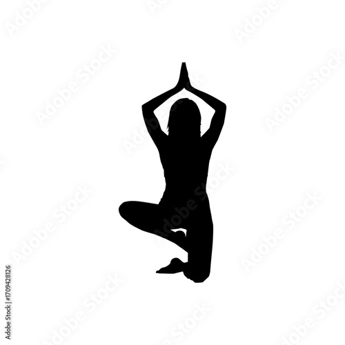 A striking silhouette of a woman performing a yoga pose, likely a balancing asana.