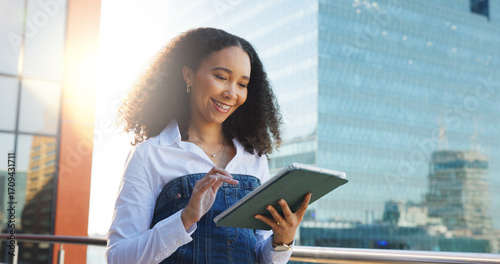 Obraz na plátně Business woman, tablet and reading in city with analysis, review or research for economic report