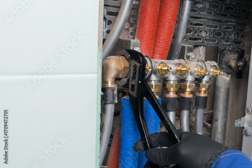 the key tightens the connecting head of the pipe that fits the shut-off valves of the communications, close-up