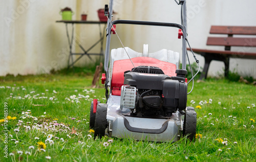 Wallpaper Mural Lawn mower is sitting on the grass Torontodigital.ca