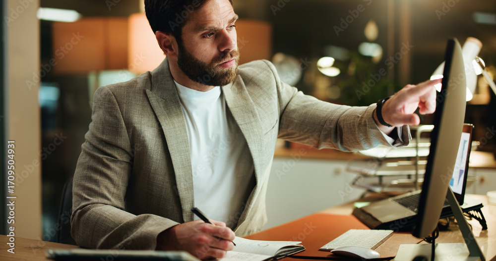 Fototapeta premium Writing, computer and businessman in office at night with research for finance report with deadline. Technology, reading and male financial manager with investment proposal for overtime in workplace.