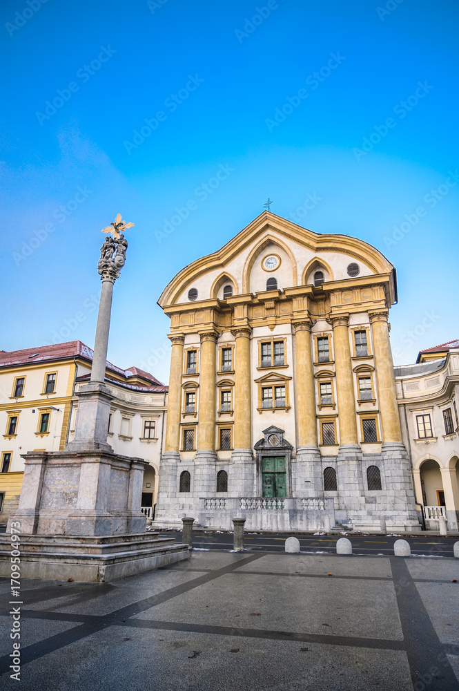 Fototapeta premium Ursuline Holy Trinity church on Congress square in Ljubljana