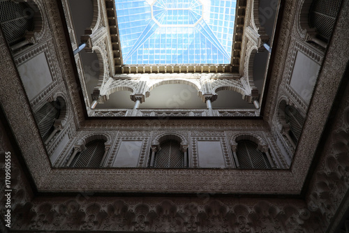 Moorish architecture in the courtyard of the doll gallery Alcazar of Seville, Andalusia, Spain
