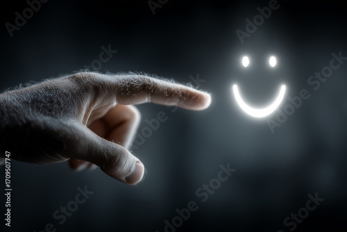 A man's hand reaches out to touch a glowing smiley face icon, symbolizing positive feedback and the human connection with technology