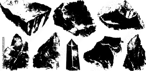 Illustration of various black rocks and crystals in a set, showcasing rough and geometric shapes. Digital vector artwork emphasizing natural elements.