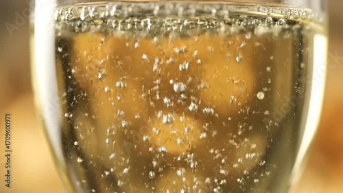 Elegant close-up of sparkling champagne or prosecco in a glass