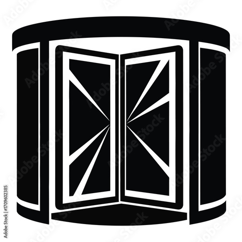 Modern revolving door entrance with distinctive geometric panel design silhouette