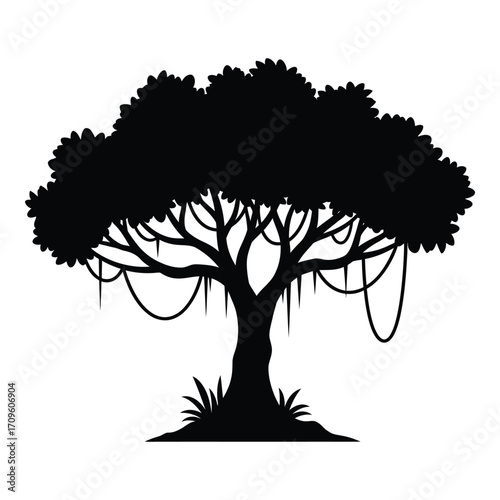 Silhouette of an old jungle tree with hanging vines and lush foliage silhouette