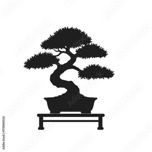 Stylized silhouette of a contorted bonsai tree on a wooden stand for artistic representation