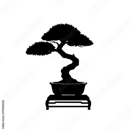 Silhouette of a meticulously pruned bonsai tree in a pot on a decorative stand evoking tranquility and artistry.