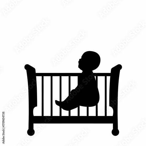 Silhouette of a baby sitting in a crib looking up thoughtfully towards the sky