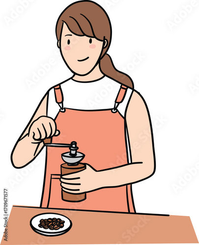 a colorful female barista use handle grinder