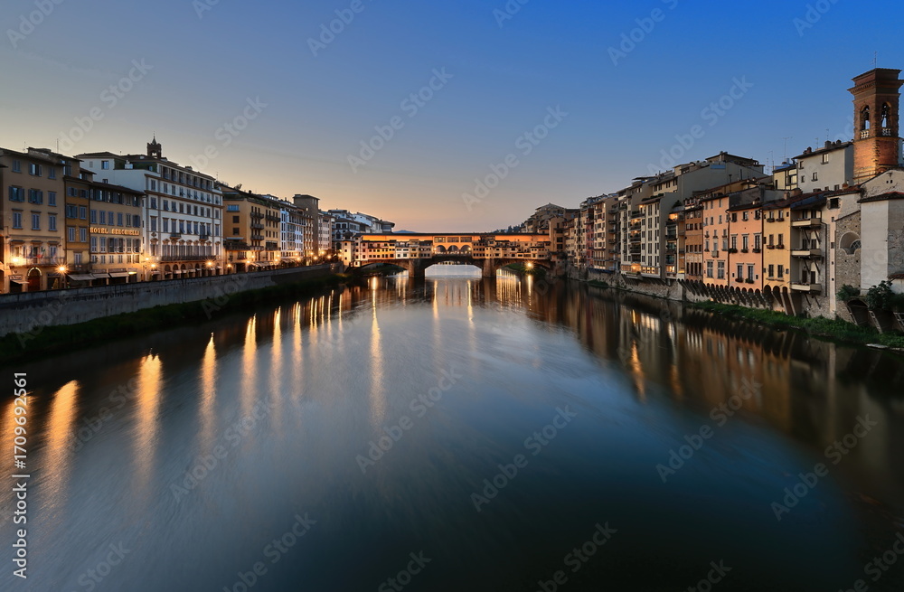 Obraz premium The Ponte Vecchio-Old Bridge at dawn in a cloudless-clear blue-sky morning, seen west-east from the Ponte Santa Trinita Bridge. Florence-Tuscany-325