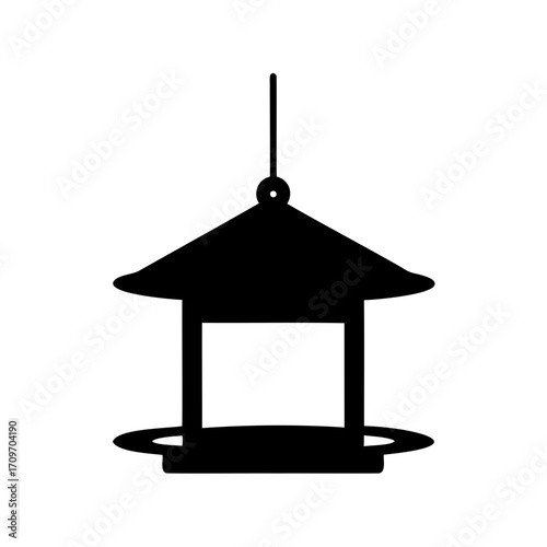 Silhouette illustration of a bird feeder with a hanging roof design