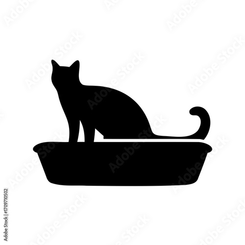 Silhouette of a cat inside a litter box with curled tail