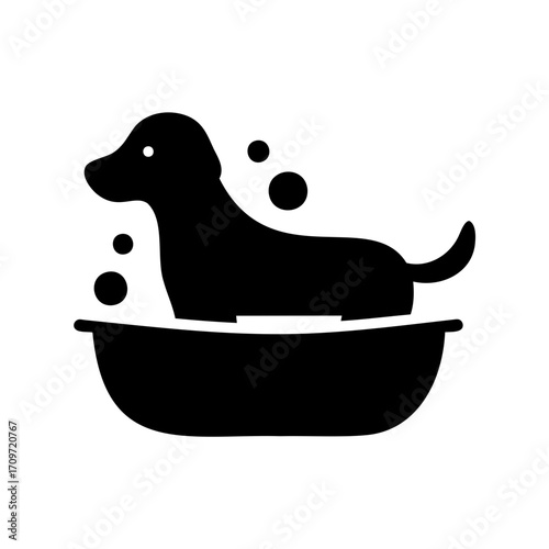Black silhouette of a dog getting a bath, surrounded by bubbles
