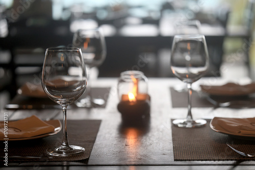 table setting in the restaurant, glasses and cutlery, a clean new table in the restaurant is waiting for guests, a free table