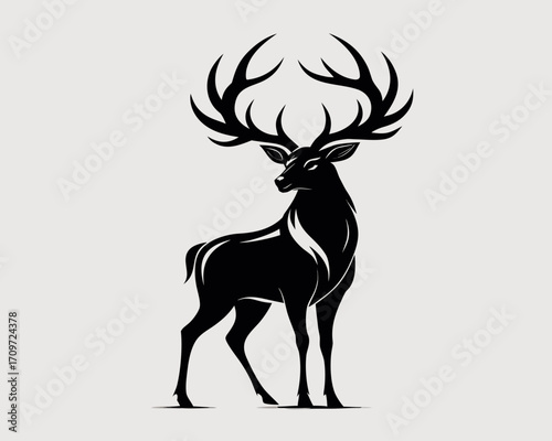 Majestic black deer silhouette with large antlers