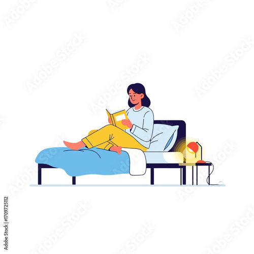 Woman relaxing in bed, reading a book, with a bedside lamp.