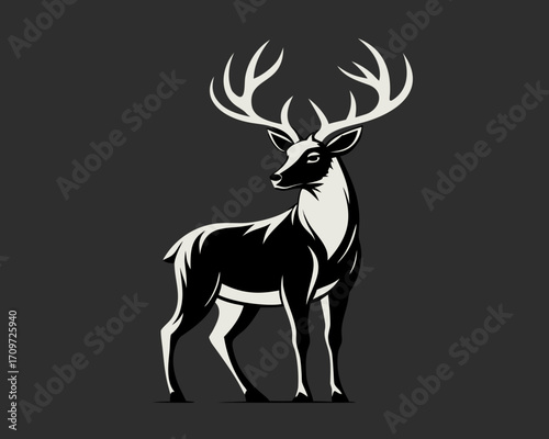 Majestic stag with antlers standing against dark background