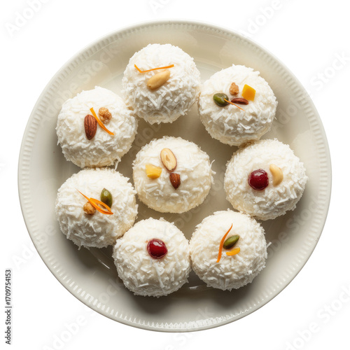 Top view of white coconut laddu sweets arranged on a plate, isolated on transparent background