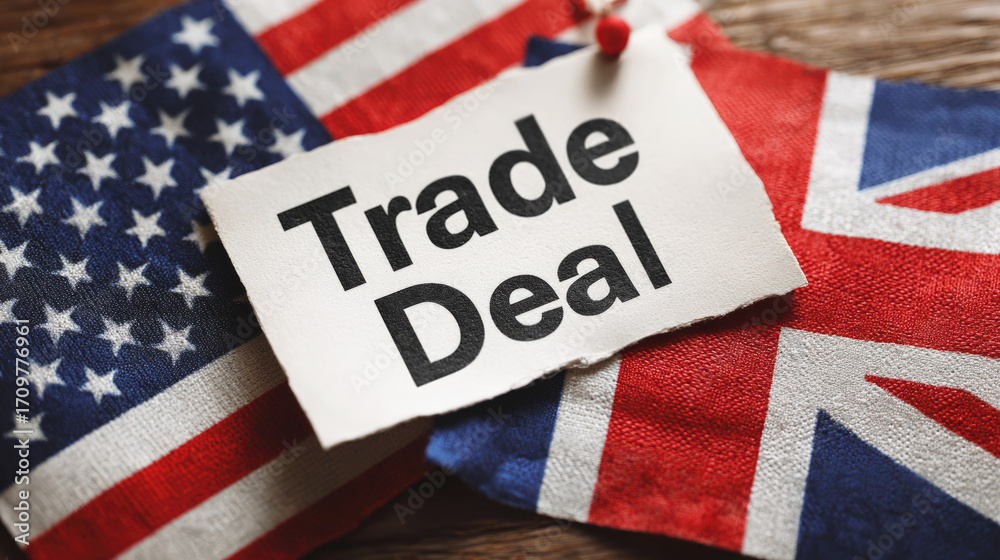 Obraz premium A conceptual image of the US-UK trade agreement, showing a torn piece of paper with the text 