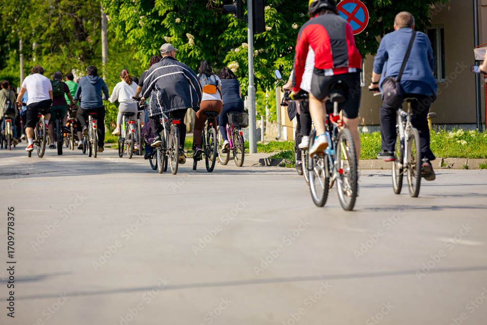 Fototapeta premium Group of cyclists on city road, street, asphalt
