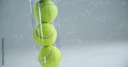 Showing transparent vertical tube holding three green tennis balls in studio, with formula overlay