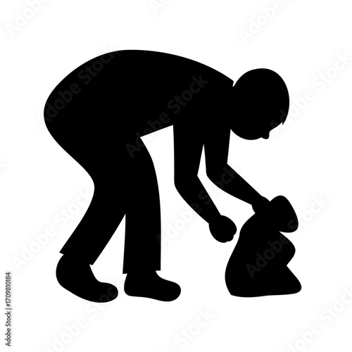 Silhouette of a person bending over picking items up and placing in bag