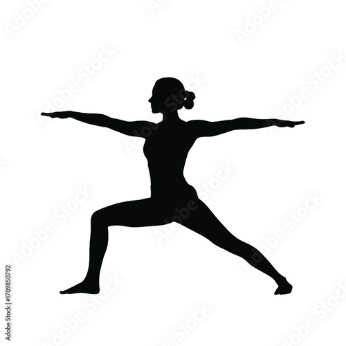 Silhouette of a woman performing warrior ii yoga pose in a dynamic stance silhouette