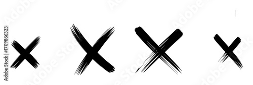 Four Black Brush Stroke "X" Marks on a White Background