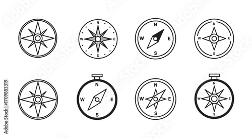 Collection of various black and white compass icons and navigational tools