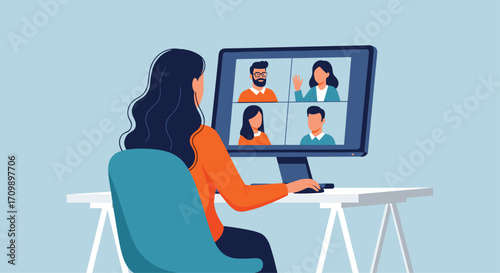 Woman engaged in virtual team meeting working from home office setup connected online