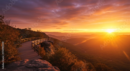 Vibrant Sunset Over Mountain Valley Landscape