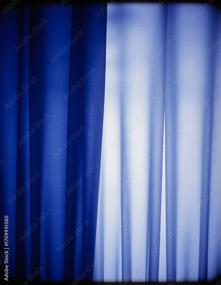 Obraz premium Indigo curtains hang gracefully, catching the sunlight that filters through, casting soft shadows and enhancing the tranquil vibe of the room. This scene invites relaxation and peace Generative AI