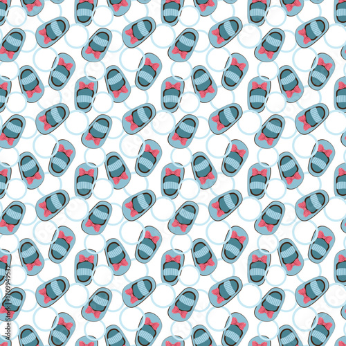 Seamless pattern with cute baby booties and pink bows for little girl nursery design
