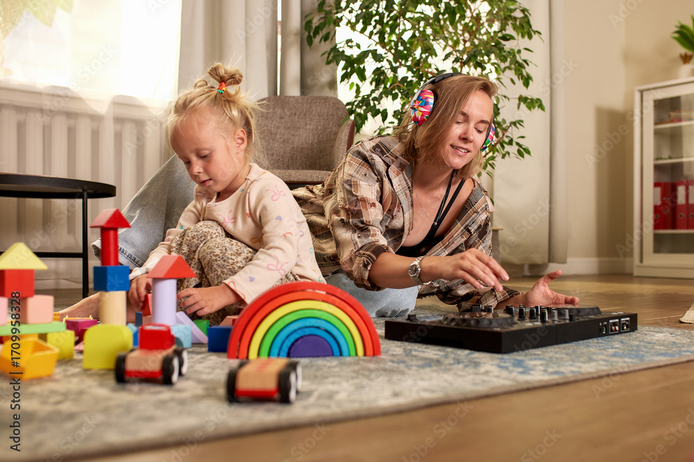 Obraz premium Mother and daughter sharing creative time in a cozy playroom