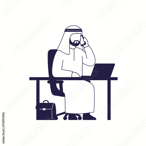 Arab businessman conducts business, seated at desk, using laptop and phone.