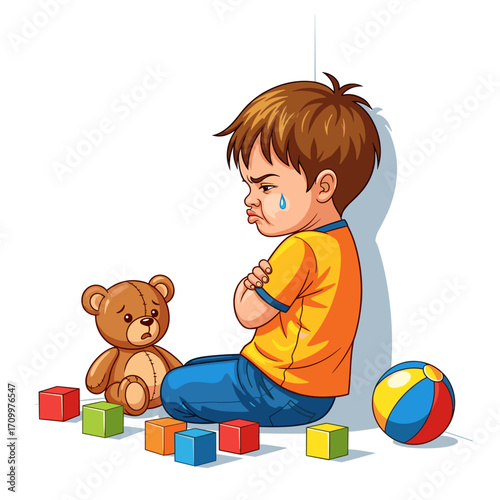 Crying boy sitting on floor with toys