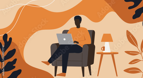 Relaxed Black man working remotely on a laptop in a cozy armchair at home. Ideal for remote work, online learning, digital lifestyle, and comfortable productivity concepts.