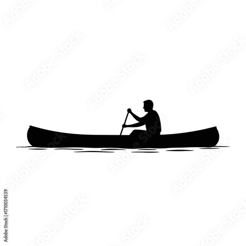 Silhouette of a lone person paddling a canoe across calm water under a bright sky