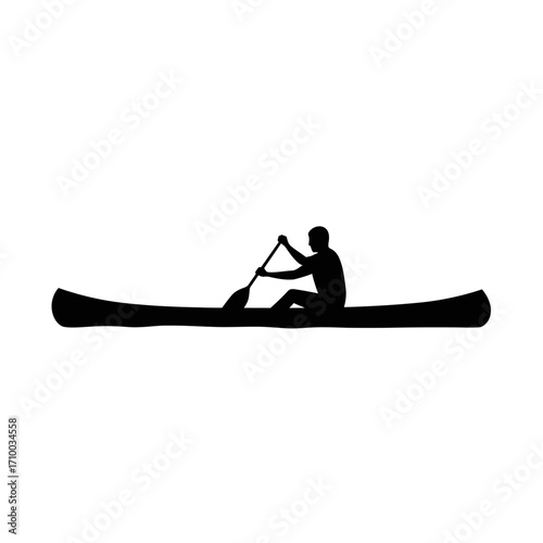 Silhouette of a lone person paddling a canoe across a calm body of water