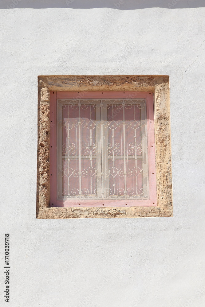 Fototapeta premium House Facade Window with Window Grill in Erriadh, Tunisia