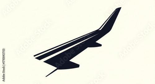 A dark airplane wing, symbolizing flight, travel, and the marvels of modern aviation engineering and transportation