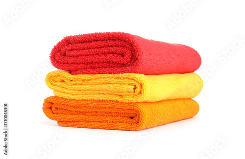 Stack of bright terry towels isolated on white
