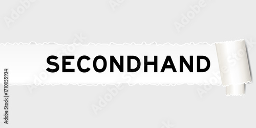 Ripped gray paper background that have word secondhand under torn part