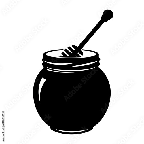 jar of honey and spoon