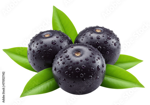 Three glossy dark purple acai berries with water droplets and cream-white scars, vibrant green leaves on a transparent background, copy space. Concept of natural freshness and health