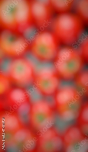 That image is a close-up, blurry shot of many red tomatoes.