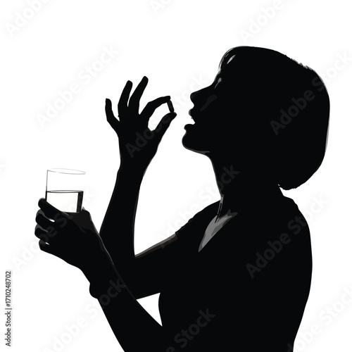 Silhouette of a person taking a pill with a glass of water, health concept.